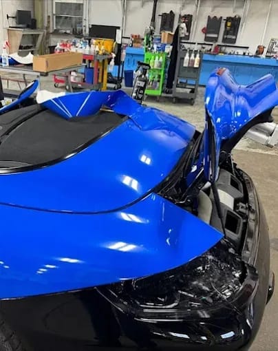 Blue vinyl wrap installation on sports car — Blue Rose Auto Detailing Springfield OR